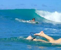 Longboard Surfing in Barbados: Glide Across Perfect Waves