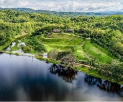 The Best Feng Shui House For Sale, surrounded by reservoir and mountains.