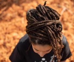 The trendy hairstyle of Interlocking locs is stylish, versatile, and long-lasting